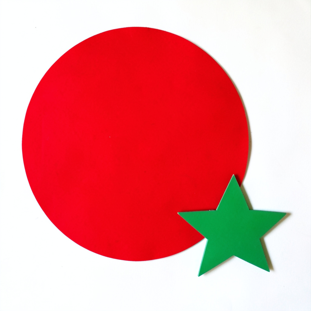 A large red circle, a small blue triangle, and a medium gree