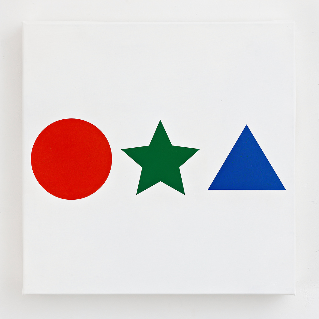 A large red circle, a small blue triangle, and a medium gree