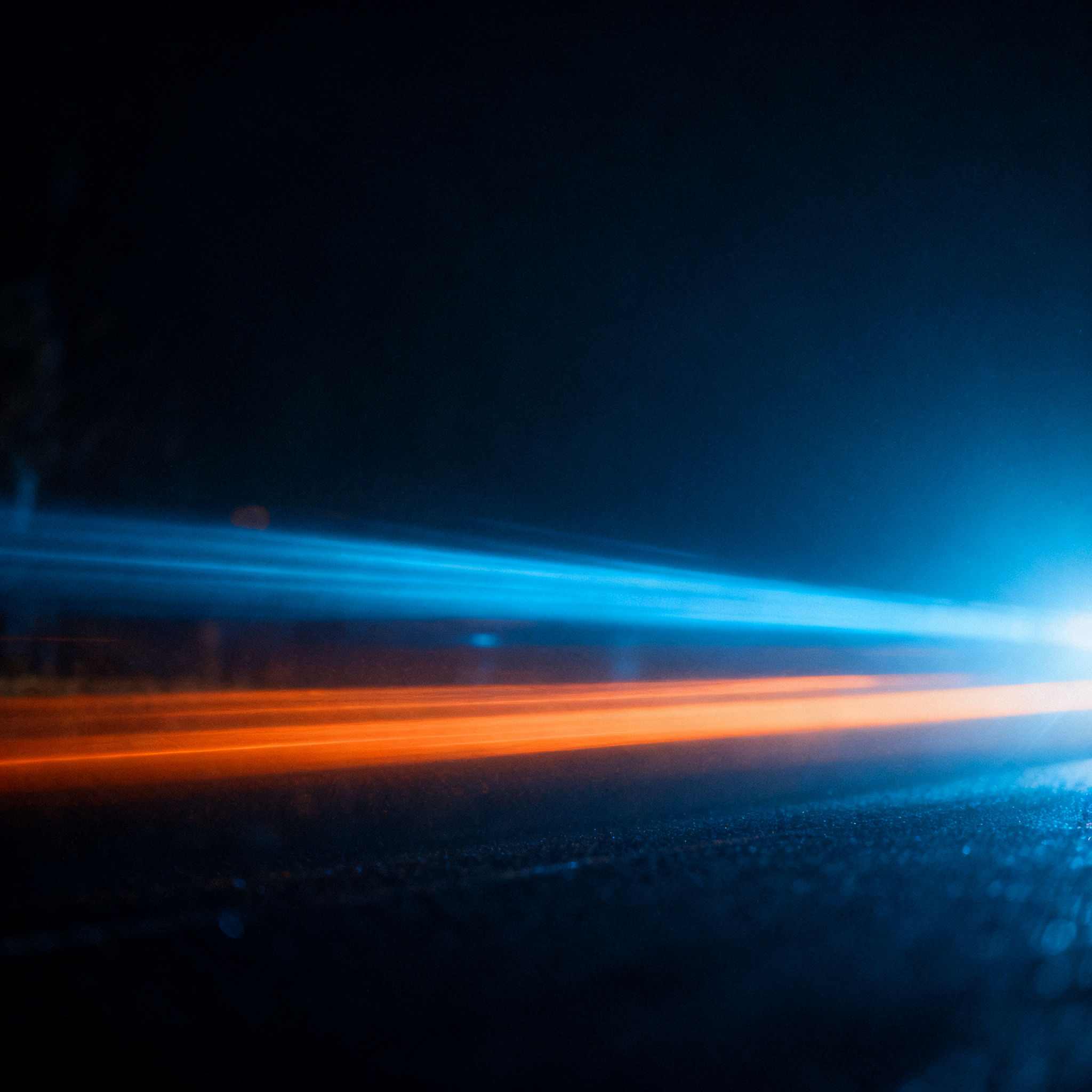 A cinematic frame with blue and orange anamorphic lens flare