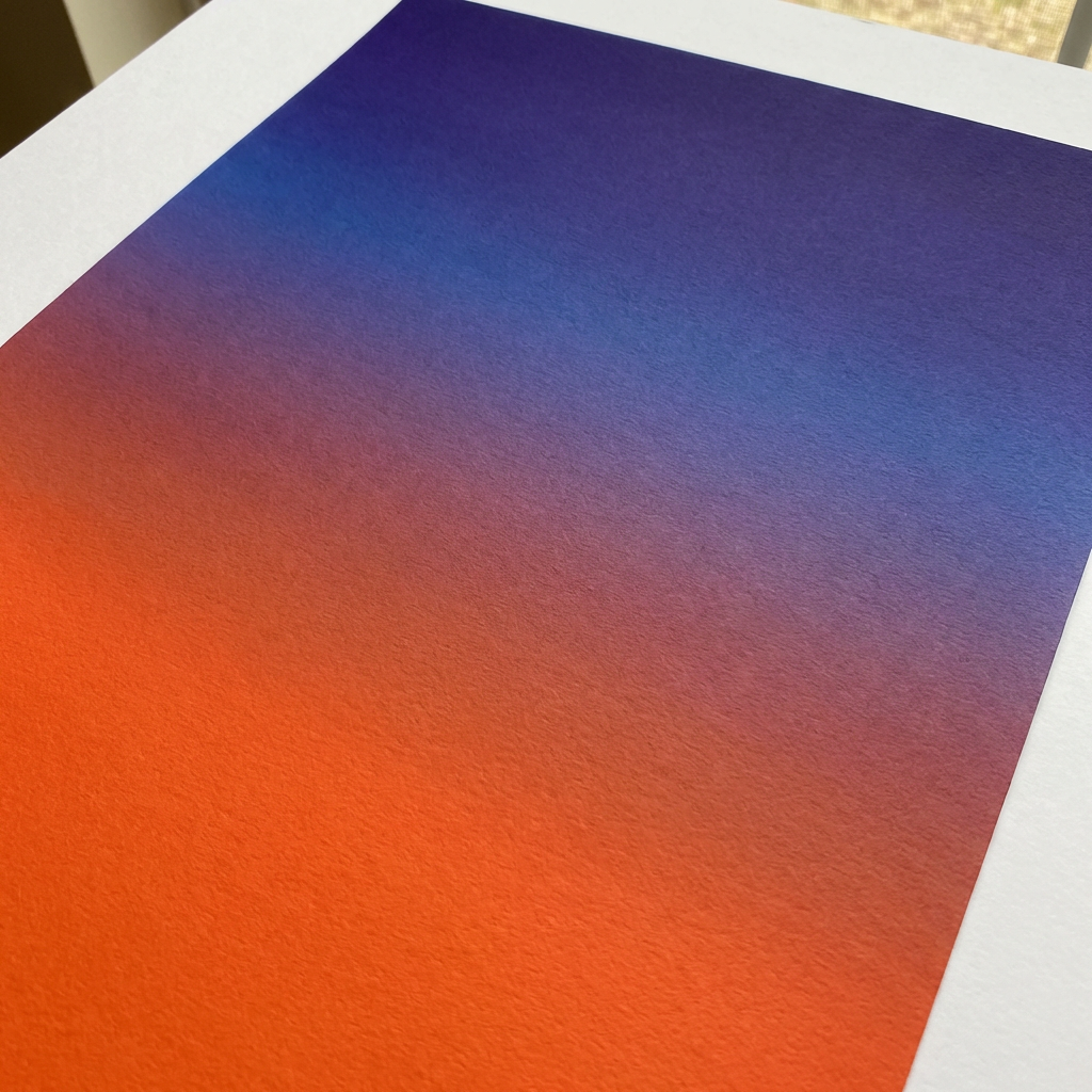 A sunset sky gradient on a flat surface from #FF6B35 (orange