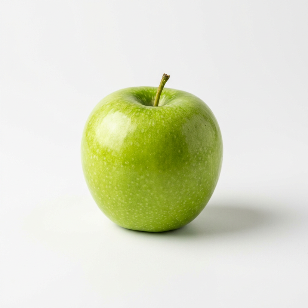 A ripe green apple on a seamless white background with soft 