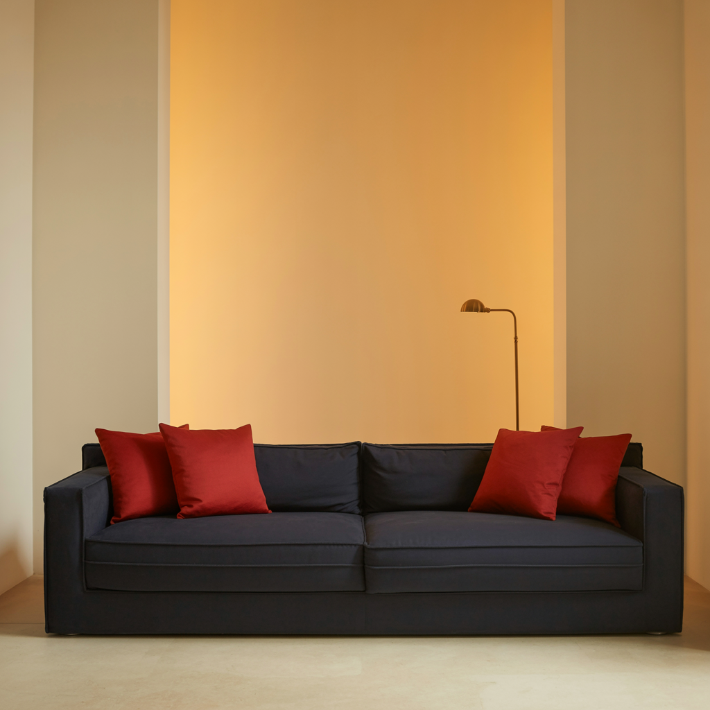 A minimalist room with walls in #F5E6CC (warm cream), a sofa