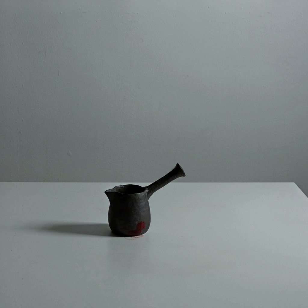A still life painted in anxious minimalism — sparse composit