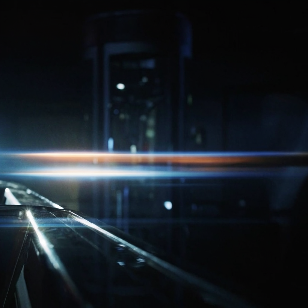 A cinematic frame with blue and orange anamorphic lens flare