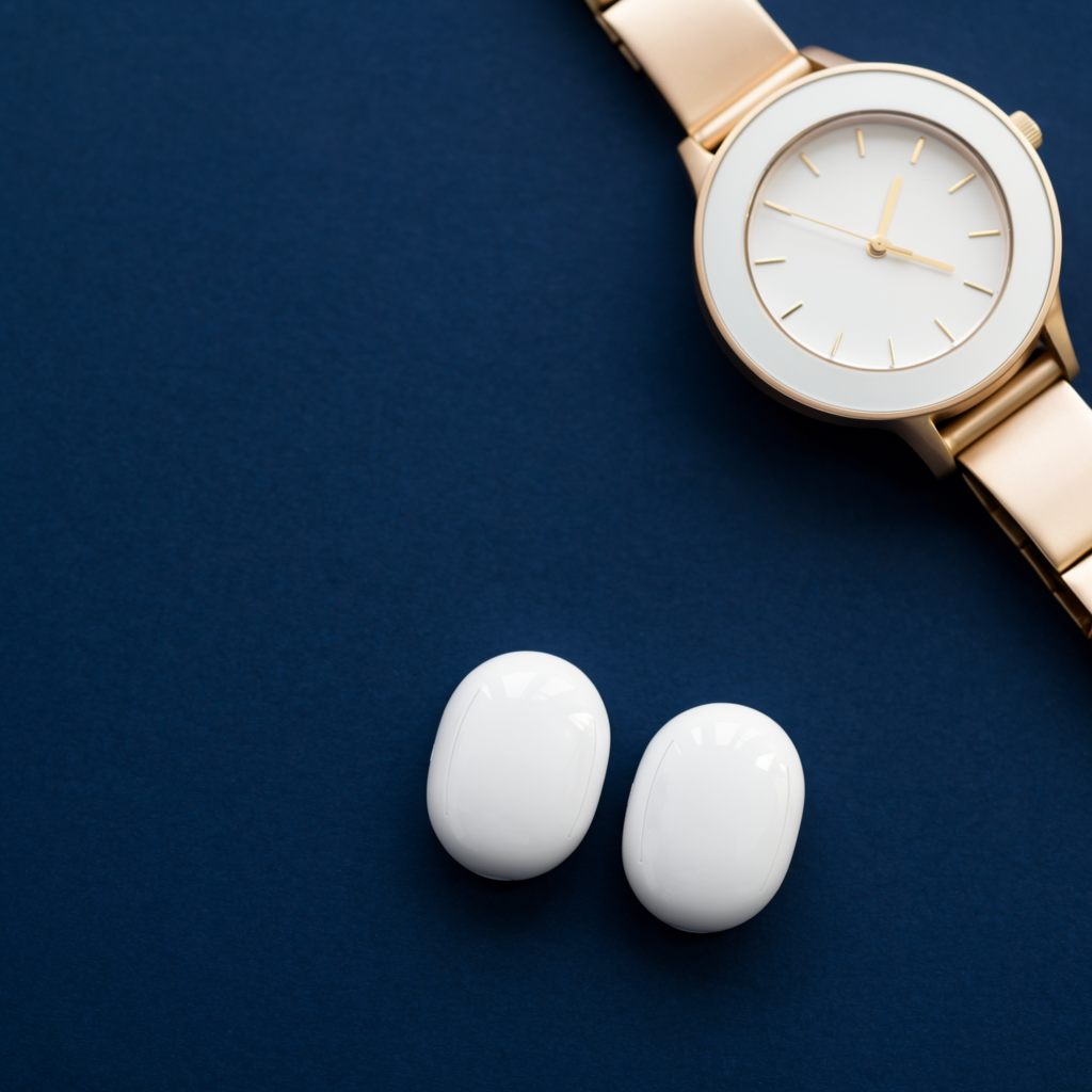 A product flat-lay on a #1A1A2E (deep dark blue) background,
