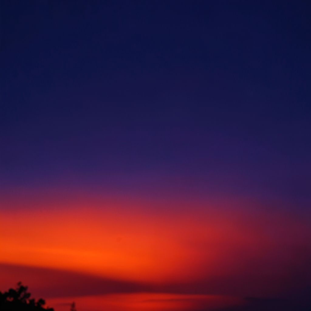 A sunset sky gradient on a flat surface from #FF6B35 (orange