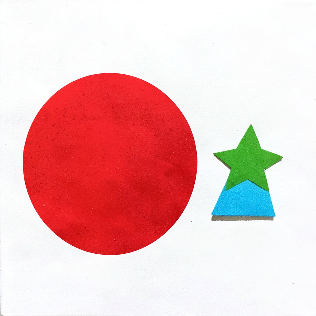 A large red circle, a small blue triangle, and a medium gree