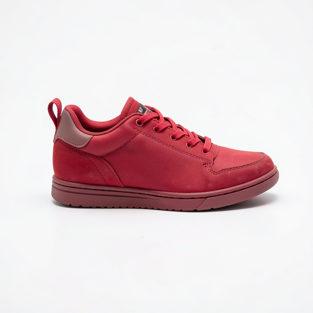 A single red sneaker on a clean white background with soft s