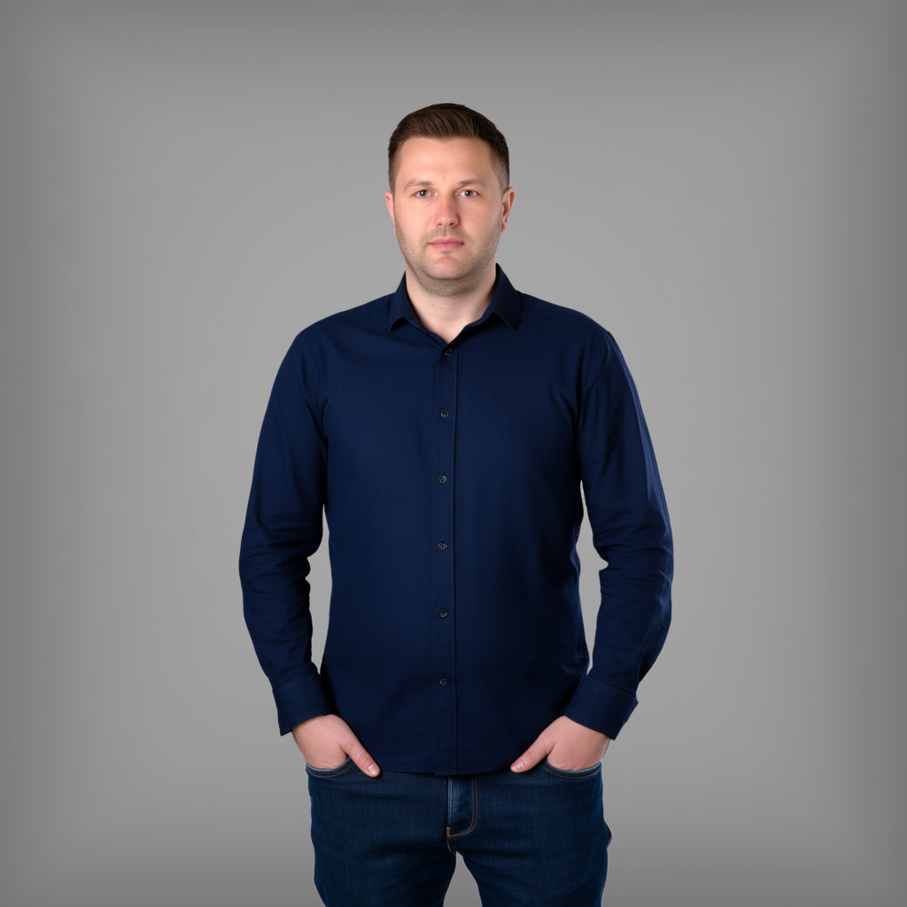 A man standing straight facing the camera, hands in pockets,