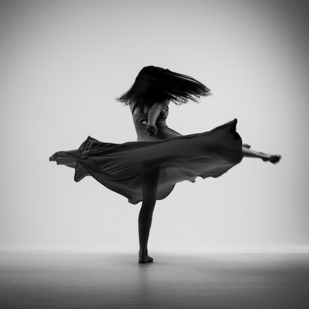 A dancer in a dynamic spin, dress flowing outward with one l