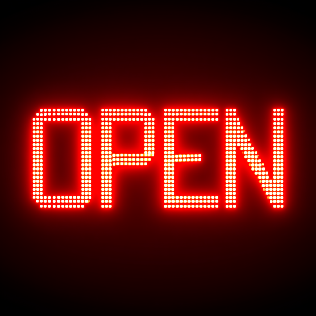 The word 'OPEN' displayed on a red LED sign with glowing pix