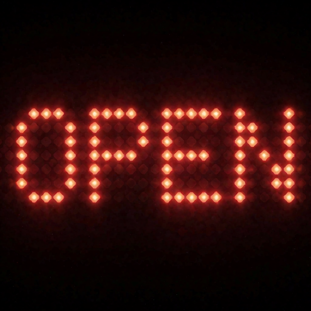 The word 'OPEN' displayed on a red LED sign with glowing pix