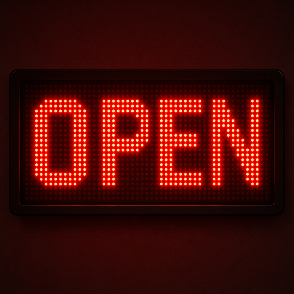 The word 'OPEN' displayed on a red LED sign with glowing pix